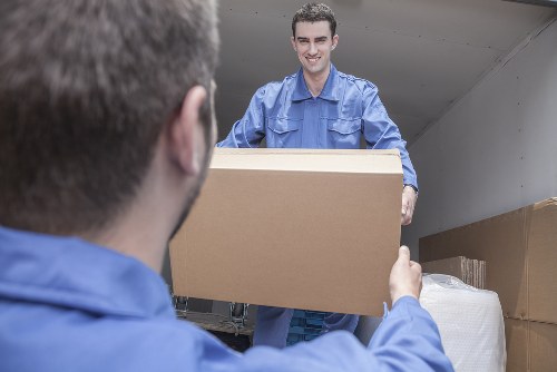 House movers preparing a Wimbledon home move with boxes and furniture
