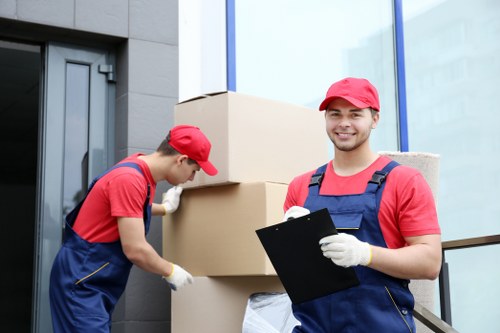Moving team handling boxes and furniture in Wimbledon