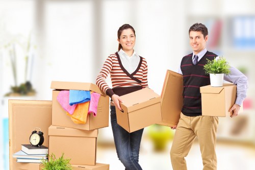 Local removal team packing boxes for a Wimbledon home move