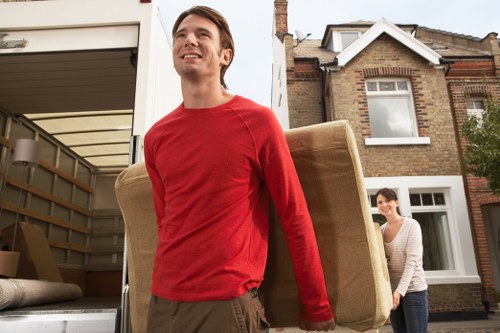 Professional movers loading household furniture in Wimbledon