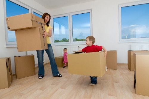 Professional movers handling packed items in a Wimbledon property