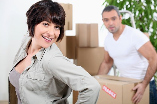 Local office movers handling desks and boxes during a Wimbledon business move