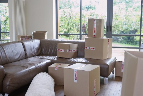 Moving team unloading boxes at a Wimbledon home